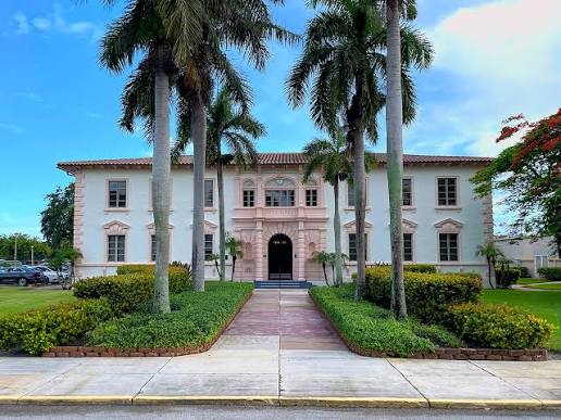 Lake Park civic building framed by royal palms
