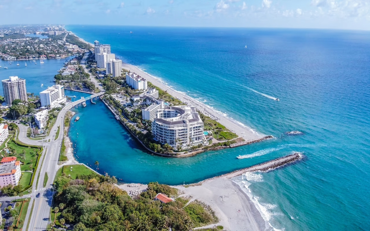 Aerial view of Boca Raton Inlet, beaches, oceanfront residences, and Atlantic coastline