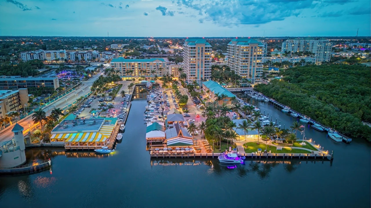 Aerial view of Boynton Beach waterfront dining, marina, and residences at twilight